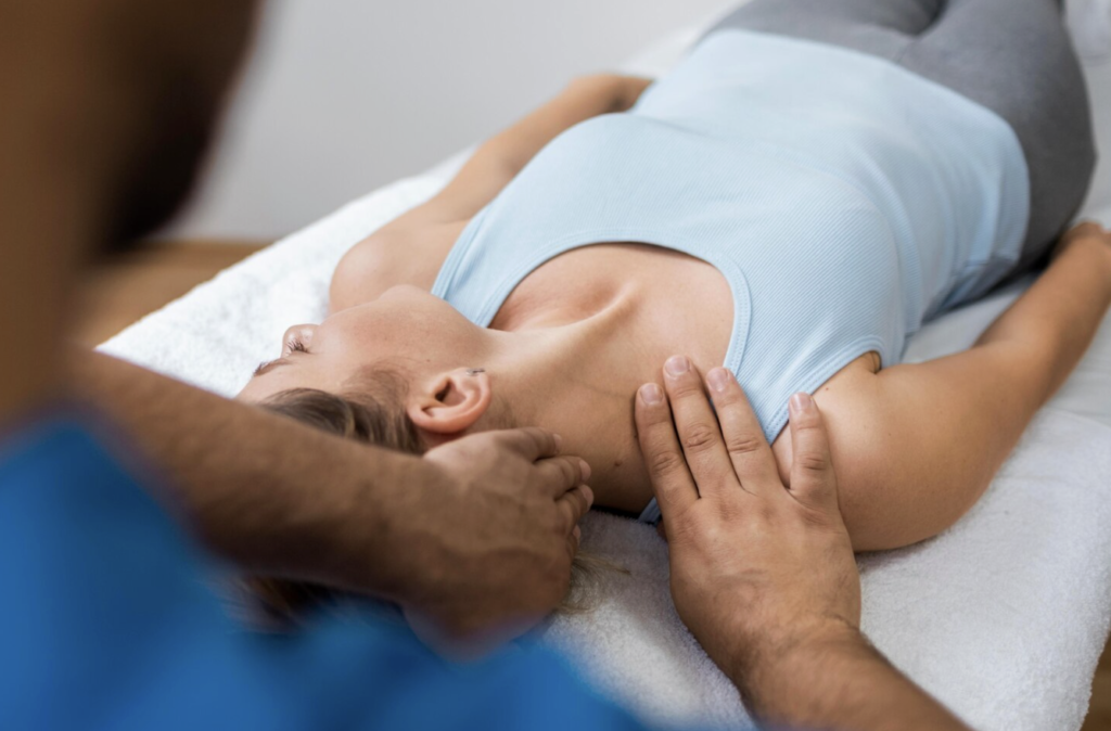 Chiropractor providing manual therapy to a patient experiencing muscle or back discomfort.